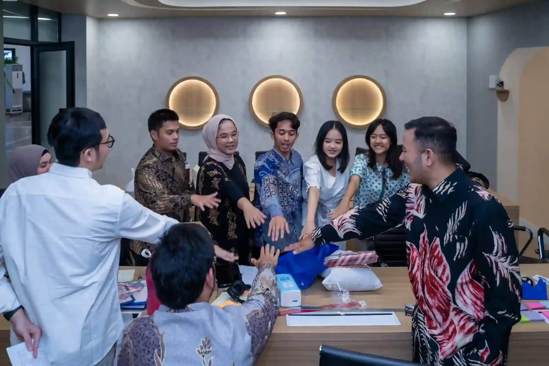 Team collaboration meeting around a wooden table